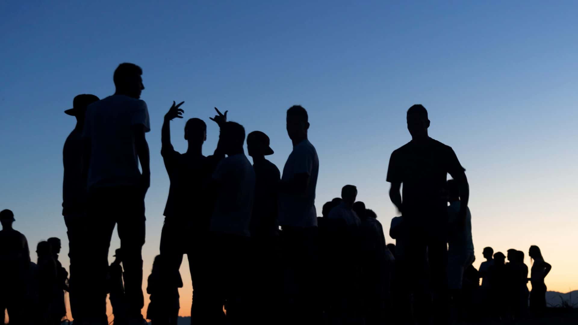 People outdoor gathering community sunset silhouette.